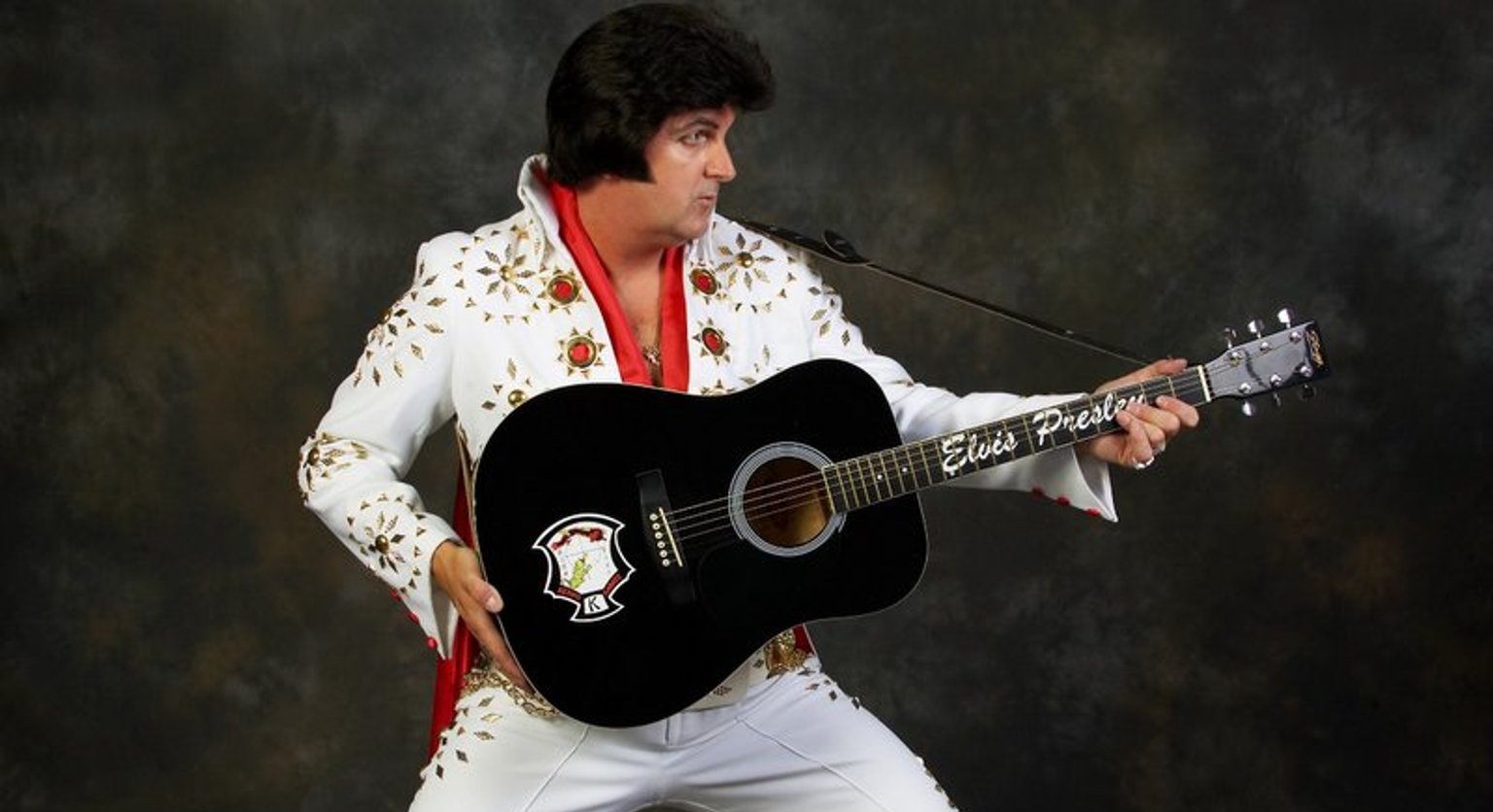 Alvin sings Elvis with a guitar